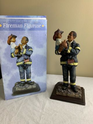 Firefighter Statue Holding A Boy,  Heavy Not A Plastic One.