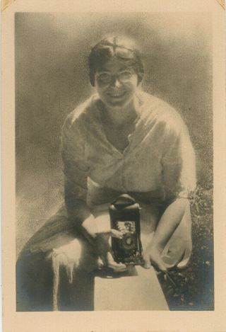 Great Self Portrait Of Woman Seated Outside Holding Folding Camera