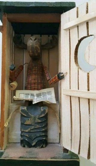 Decorative Wooden Outhouse With Moose Reading The Newspaper