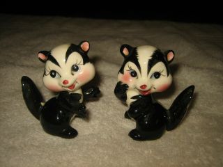 Set Of 2 Adorable Ceramic Glazed Shiny Skunk Figurines