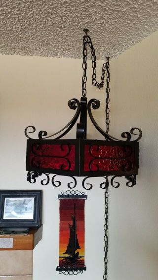 Vintage 1960s Wrought Iron Red Glass Paneled Gothic Mission Style Swag Lamp