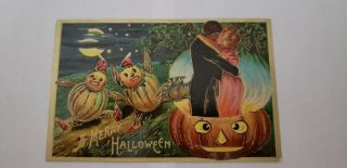 Vintage Halloween Postcard Man And Women Kissing With Pumkin Men Looking.