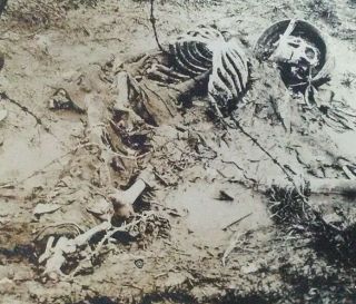 WWI RPPC Death German soldier skull skeleton helmet grenade trench war mud 3 3