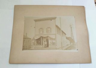 Old Photo Of General Store With Windmill On The Side