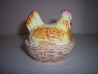 A Yellow And Orange Hen On A Nest Salt And Pepper Shakers