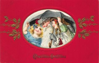 Christmas Greetings Red Suited Santa Claus Girls Winsch Embossed Postcard.