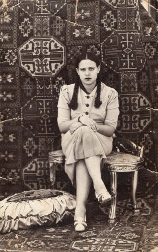 Egypt Vintage Photo.  Lady With Long Braids And Oriental Carpets.  Photo Shokry