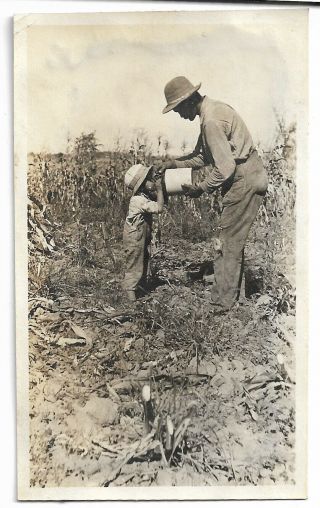 Vintage Snapshot Photo African American Farmer Giving Child Drink From Stoneware