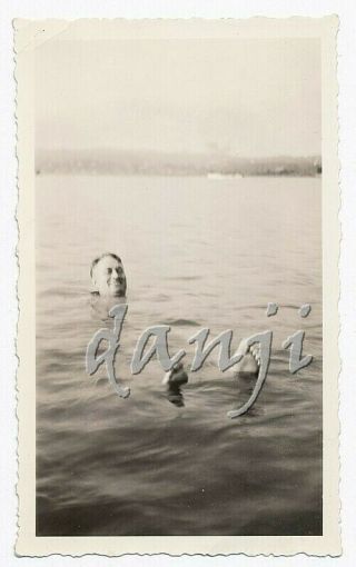 Man Floating Under Water With Only Head,  Feet Sticking Out Of The Water Old Photo