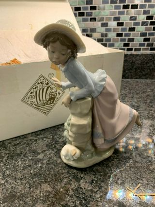 Nao By Lladro Girl Leaning On Wall With Puppy With Box
