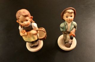 2 Hummel Goebel Figurines - 1 " Sister " Girl W/basket & 1 Happy Traveler Boy