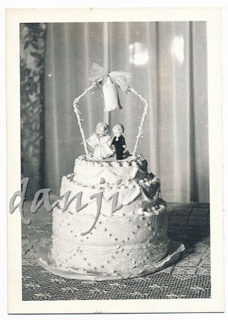 Close Up Wedding Cake With Bride,  Groom Cake Topper On Lace Tablecoth Old Photo