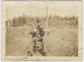 1920s Snapshot Of A Well - Dressed Man In A Chair Playing A Fiddle In A Field