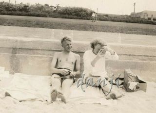 Swimsuit Couple With Paddle Ball With Feet In Camera Sit On The Beach 1937 Photo