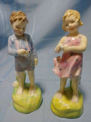 Set Of 2 Royal Doulton Porcelain Figurines " He Loves Me " And " She Loves Me Not "