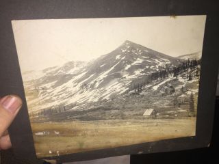 Old Photo Of A Large Homestead At The Base Of A Tall Hill Near Bolder,  Colorado