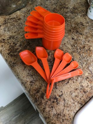 Tupperware Orange 6 Measuring Cups Full Set And 7 Spoons,  Full Set.
