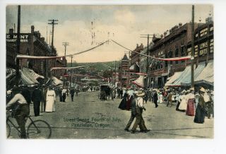 Busy Street On 4th Of July Pendleton Or Hand - Colored Bicycle Beer Sign 1910