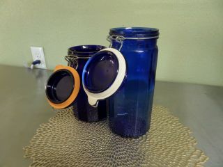 Set Of 2 Vintage Cobalt Blue Glass Canister Jar Paneled Wire Bail Lidded