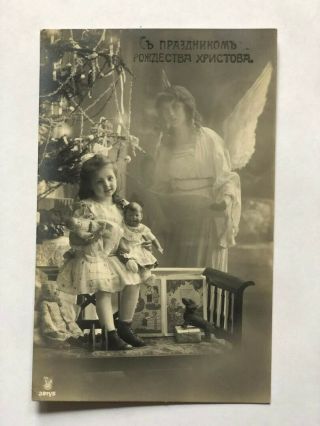 Real Photo Postcard Young Girl Sitting In Front Of Christmas Tree With Angel