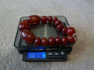 Vintage Cherry Amber / Bakelite ? Bracelet,  Made from 16 beads - 65.  6 grams. 2
