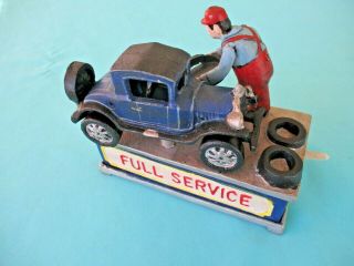 Old mechanical cast iron coin bank Old car & mechanic 