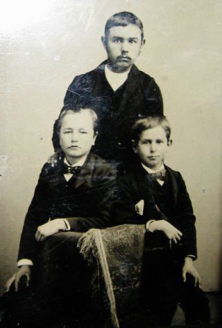Antique Tintype Photo Portrait Of A Young Man Posing With 2 Looking Boys