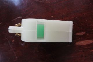 Old glow in the dark Edling Funeral Homes plastic whistle,  key chain,  advertise 2