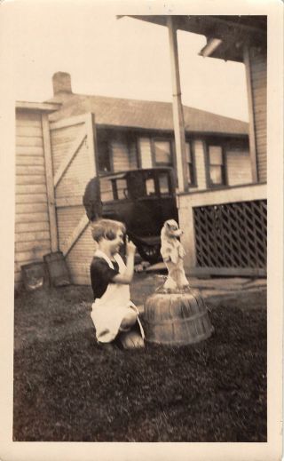 1920s Little Girl Playing With Dog Vintage Pickup In The Background Blurry Photo