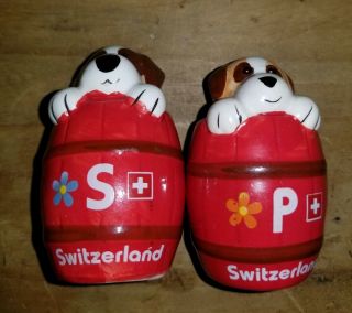 Ceramic Dog In A Red Barrel Salt And Pepper Set Shakers.  Switzerland Made.