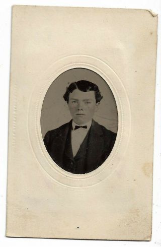 Embossed Frame Holding A Tintype Photograph Of A Young Man Bow Tie Ca 1860 - 70s