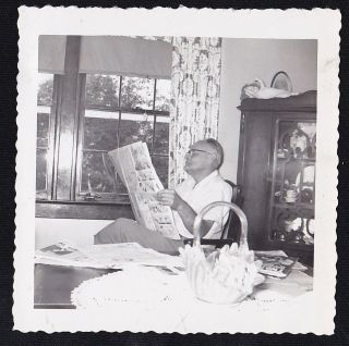Old Vintage Antique Photograph Man Reading Newspaper In Retro Dining Room