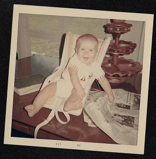 Vintage Photograph Adorable Baby Sitting In Chair Playing With Newspaper