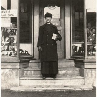 Vintage Snapshot Found Photo Priest Posing On Steps Of Shoe Store W Box In Hand