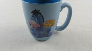 Disney Store Eeyore Large Ceramic Coffee Mug Cup 2 Tone Blue Holding Flowers