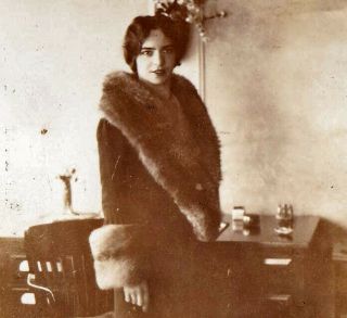 Young Woman In Fur Coat By The Desk - 1920s Snapshot Photo