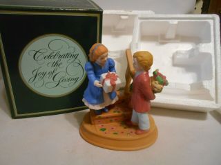 1984 Avon Figurine Christmas Memories Series " Celebrating The Joy Of Giving "