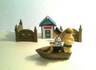 Two Boys In A Boat Going Swimming Figurines - Boat House Is Separately