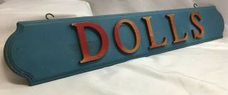 Vtg.  Wooden " Dolls " Sign,  24 " X 4 ",  W/ 2 Hooks,  Letters 2 3/4 ",  Blue Bkgrd N4