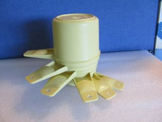 Tupperware yellow 6 piece measureing cups. 2