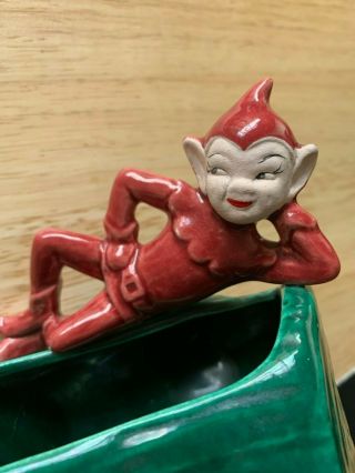 Vintage Ceramic Red Elf Pixie Laying On A Green Tree Trunk Planter