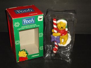 Noma Disney Winnie The Pooh,  Pooh Holding Candy Cane Christmas Stocking Holder