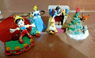 Enesco Classic Disney 4 Piece Christmas ornaments.  Pinocchio,  Cinderella Bambi 2