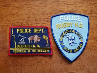Two Different Colorful North Dakota Police Patches: Rugby And Belfield