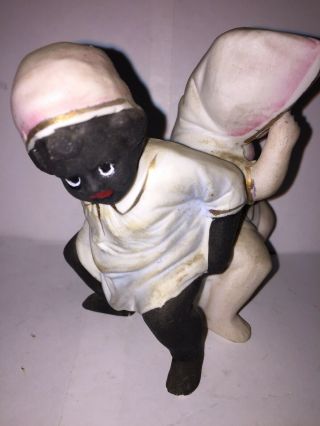 Bisque Figure Of A Black Boy And White Girl Sitting On The Same Chamber Pot. 3