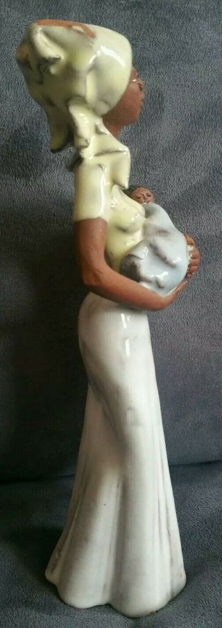 VINTAGE AFRICAN AMERICAN WOMAN CARRYING BABY 9.  5 