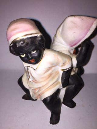 Bisque Figure Of A Black Boy And Black Girl Sitting On The Same Chamber Pot. 3