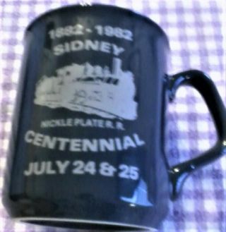 Vintage 1882 - 1982 Sidney Indiana Nickle Plater.  R.  Mug